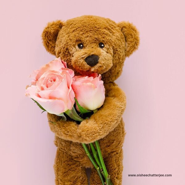 A cute teddy and roses