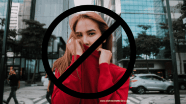 Image of a woman wearing a red top showing banned symbol